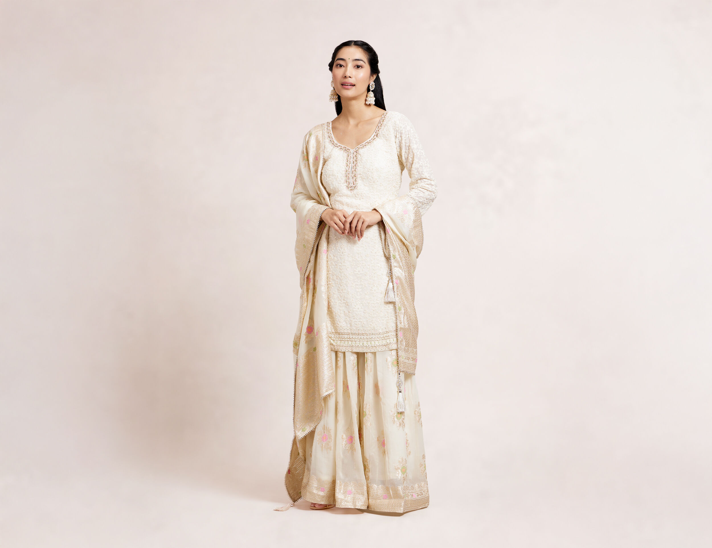 A women wearing Trendy white shararas options for Indian wear
